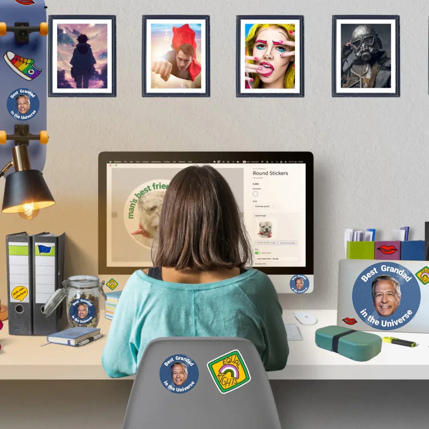Person sitting at a desl ordering custom stickers online with personalised stickers and wall stickers decorating home workspace