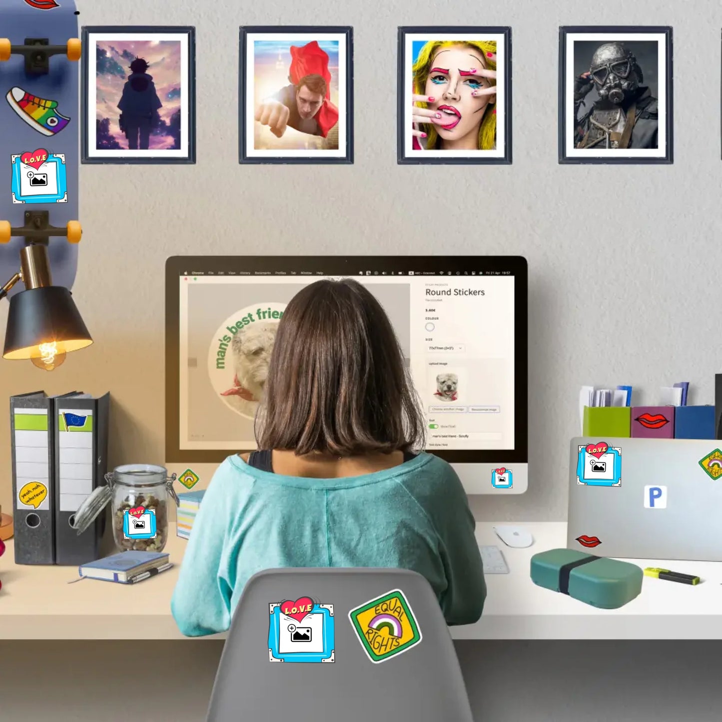 Woman sitting at desk designing personalised stickers with wall art stickers decorating home workspace