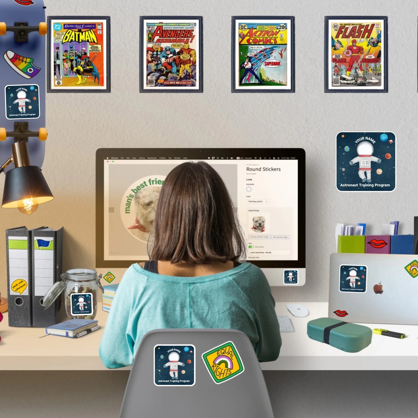 Woman sitting at a desk designing personalised stickers online with stickers and wall art stickers decorating home workspace