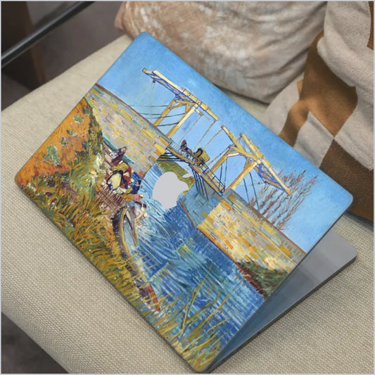 Van Gogh Langlois Bridge at Arles MacBook skin with colourful canal bridge artwork in blue and gold tones