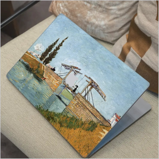 Van Gogh Langlois Bridge MacBook skin with canal bridge artwork in soft blue and golden tones
