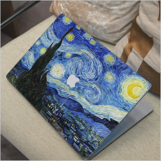 MacBook laptop with Van Gogh Starry Night skin applied, featuring iconic blue swirl artwork and premium vinyl finish compatible with Apple MacBook models